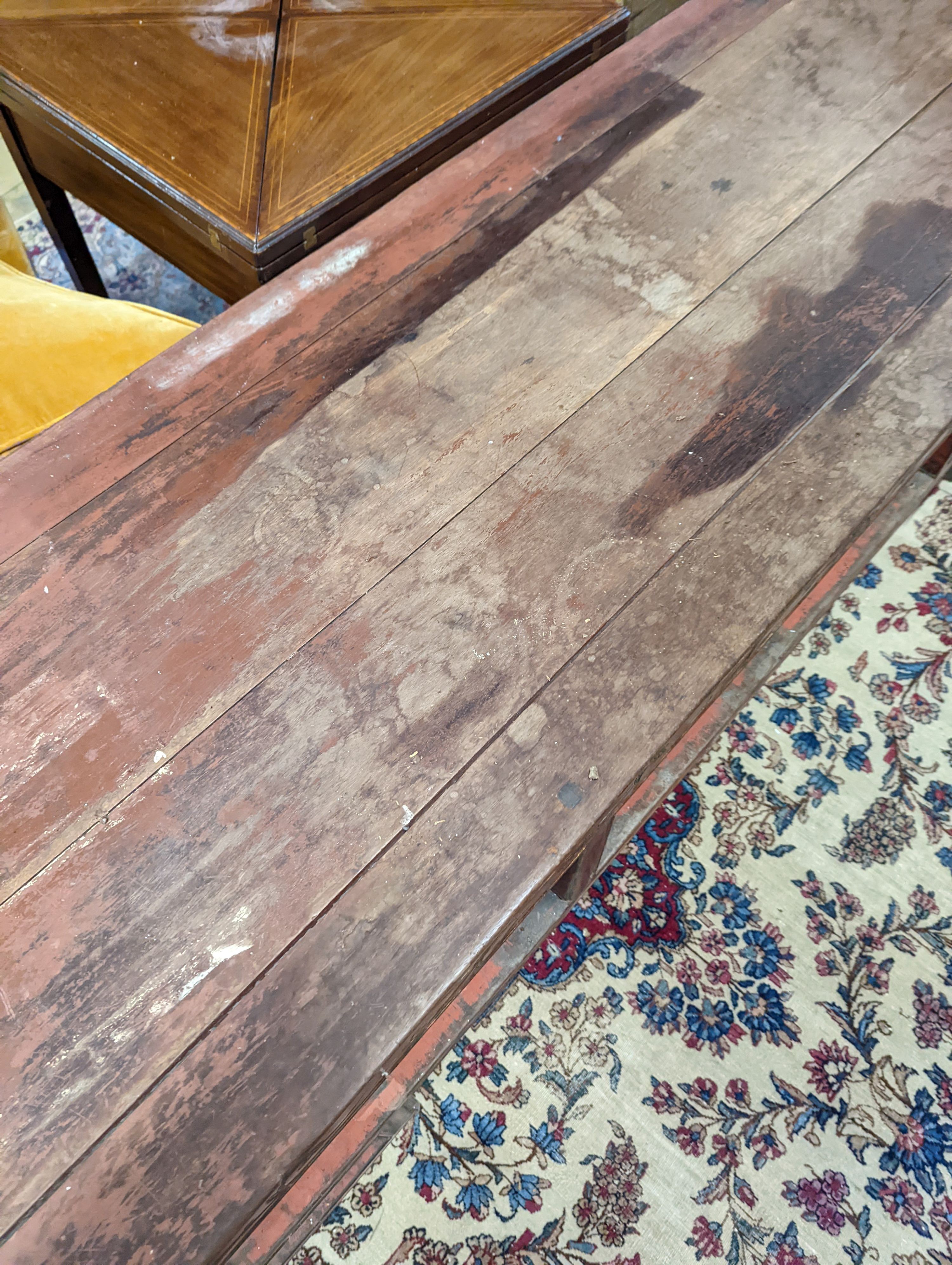 A Chinese red lacquer hardwood low altar table, width 240cm depth 56cm height 56cm